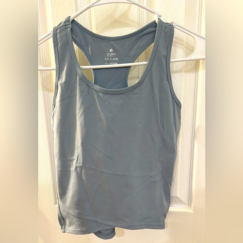 Light blue. Never worn. Size small.
